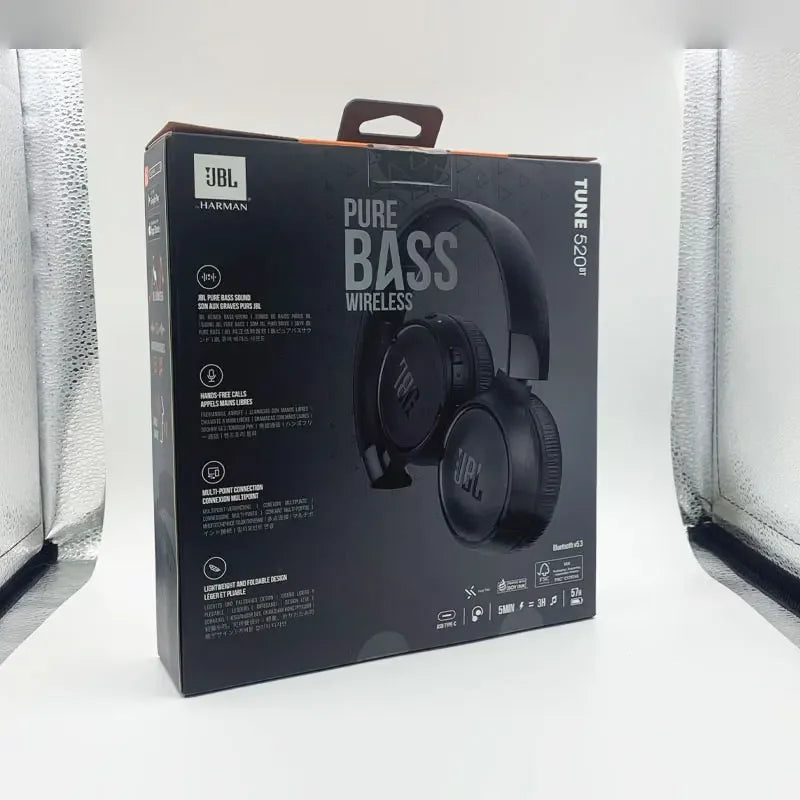 JBL TUNE 520BT wireless Bluetooth headphones with over-ear design and cushioned ear cups, black color, front view.